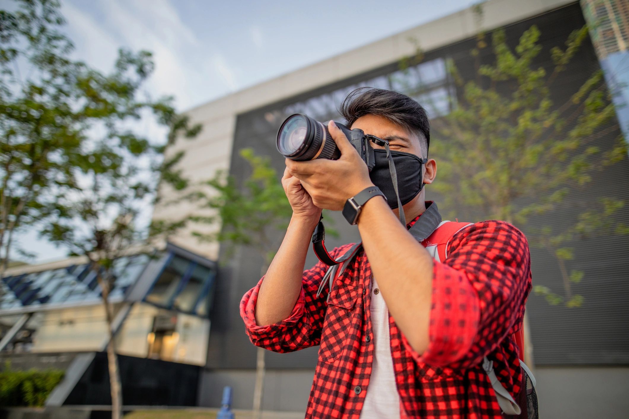Reporter on location with camera