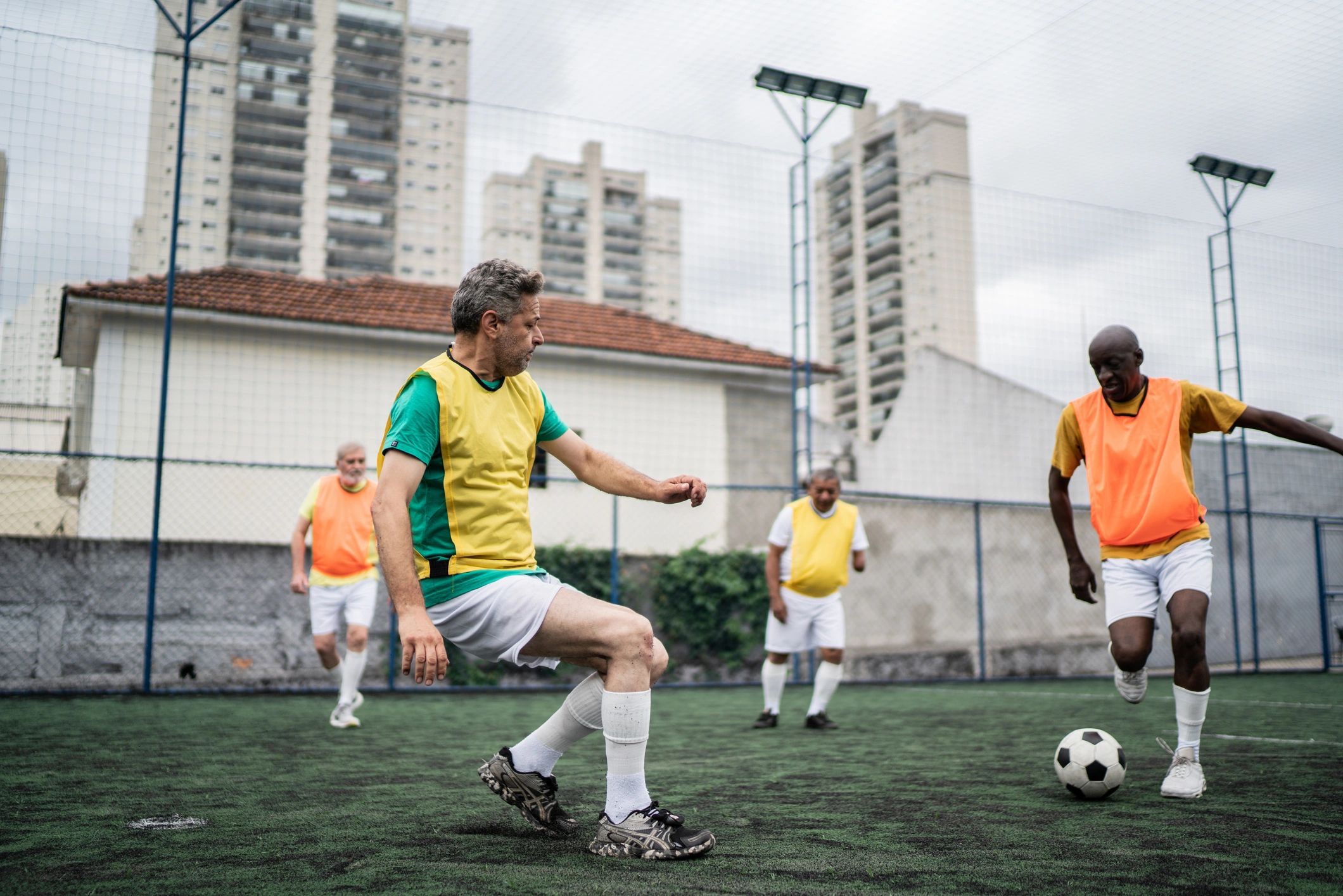 Men playing soccer on a field