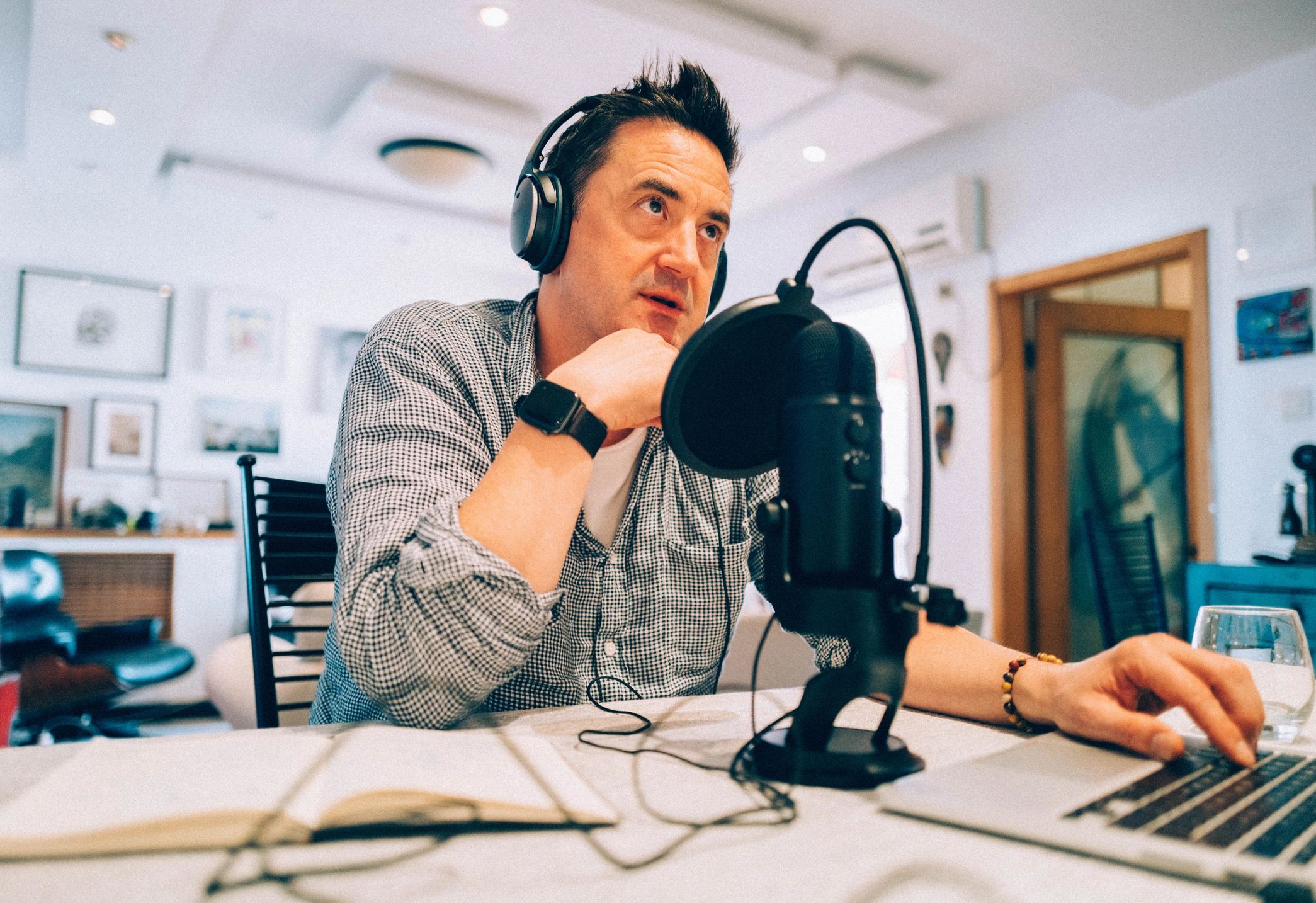Man recording a podcast at home