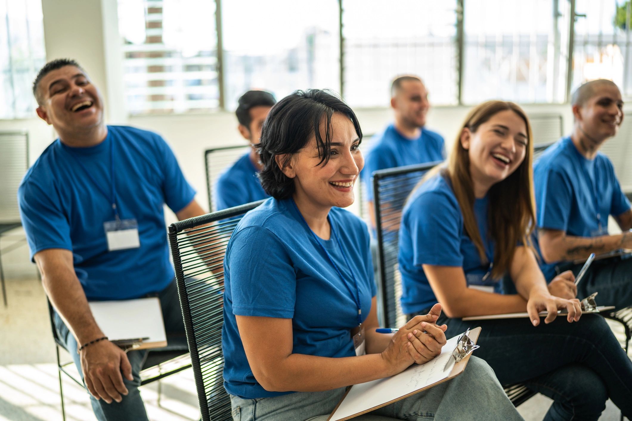 Audience smiling during a community presentation