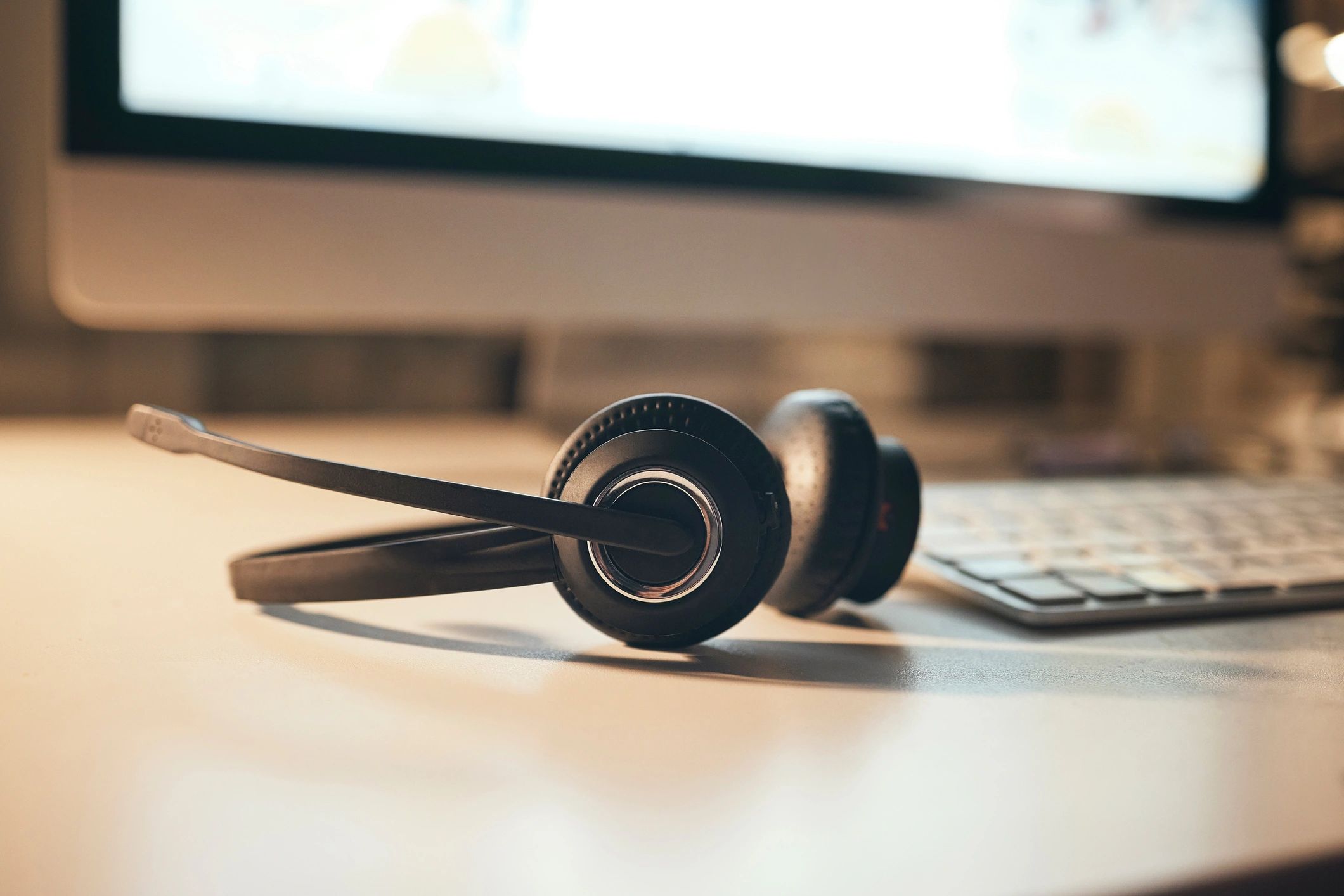 Headphones and audio equipment on a desk