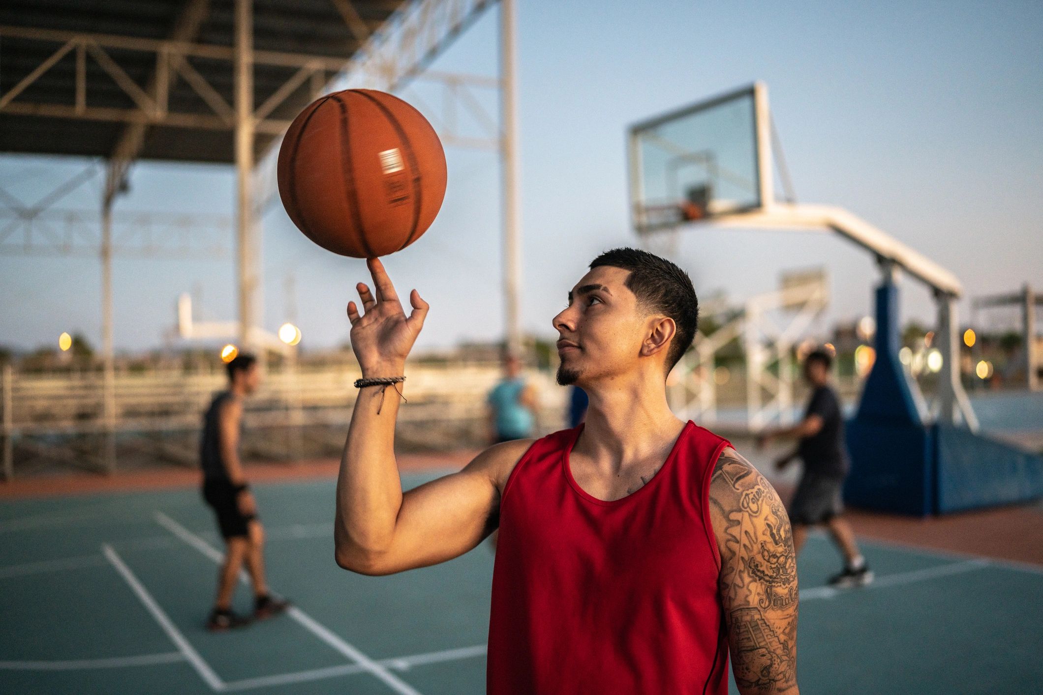 Person spinning a basketball on a finger