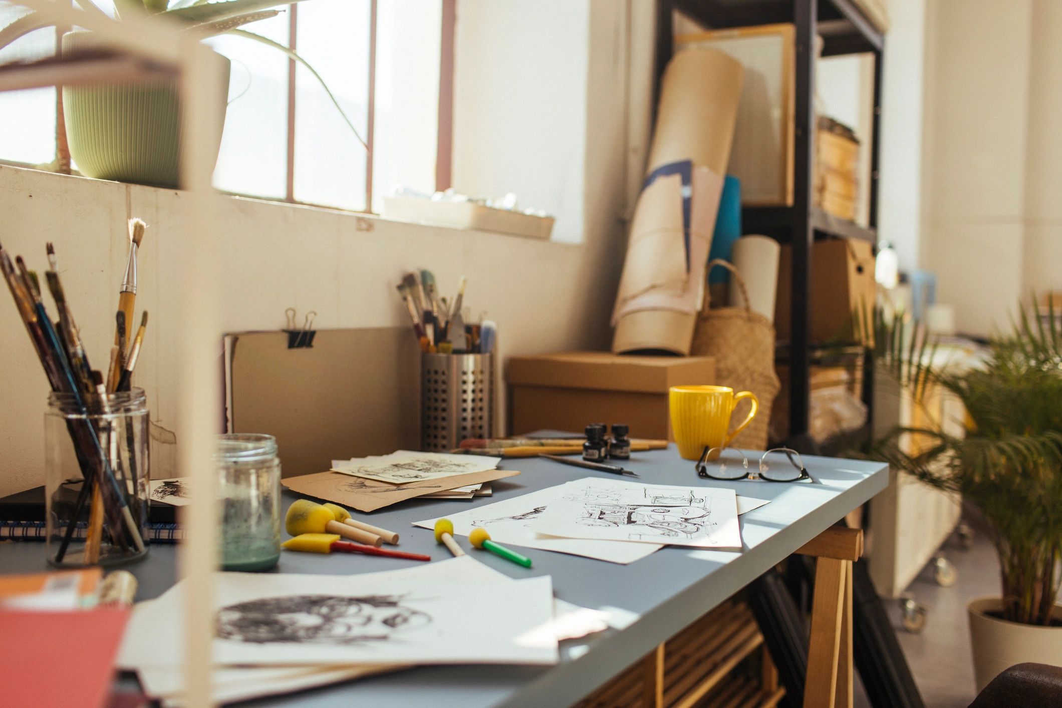 Sketches and papers on an artist table