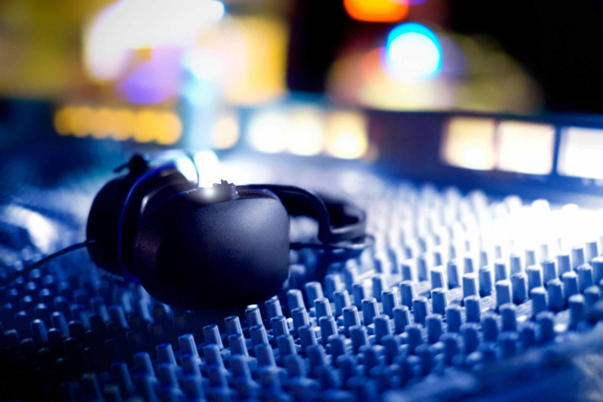 Audio mixing console with headphones