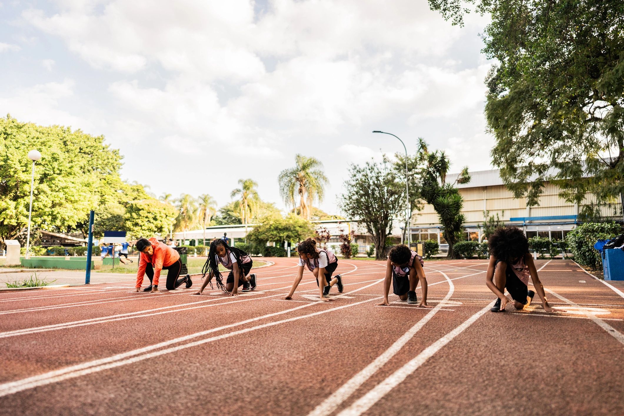 Athletes practicing on a running track