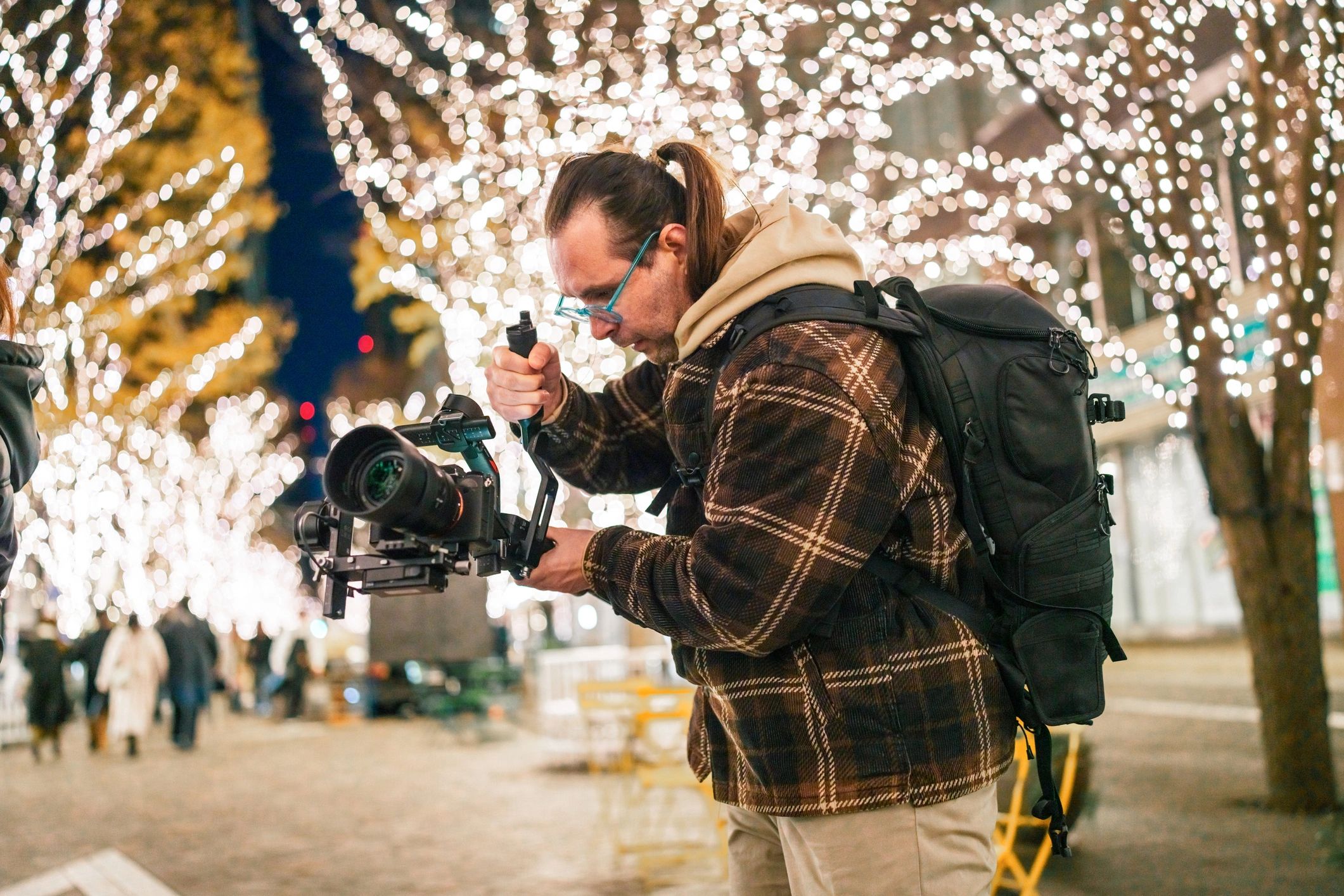 Camera operator using a gimbal at night