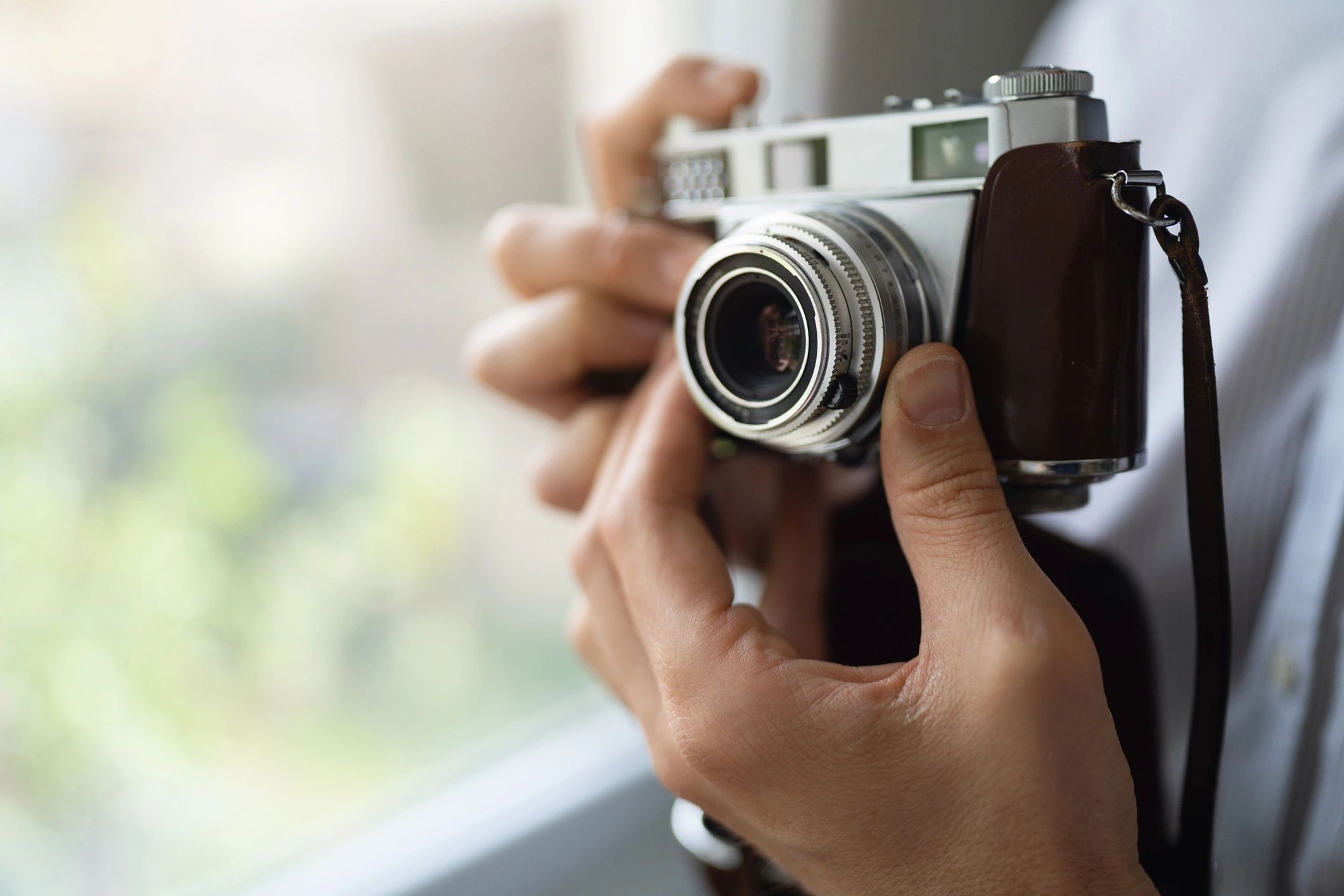 Person holding a camera