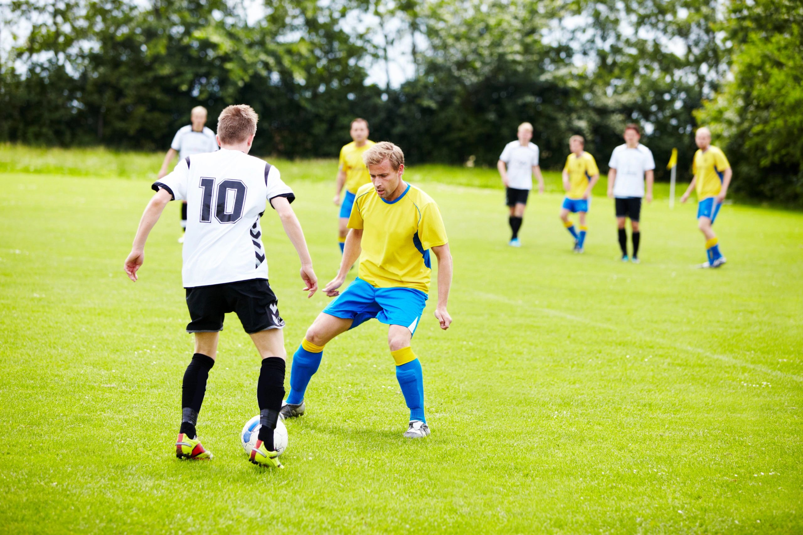 Soccer players contesting the ball